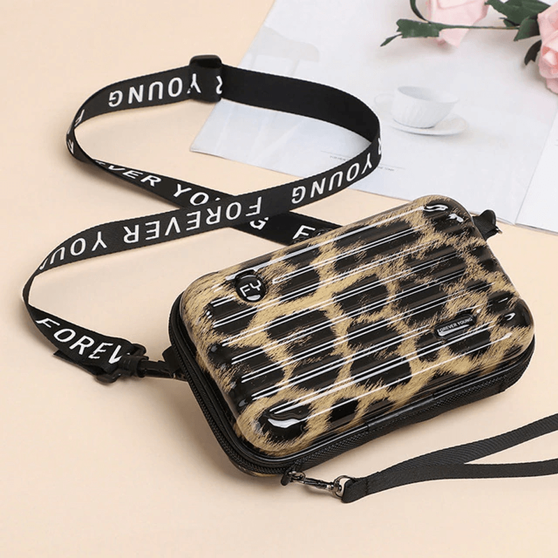 Reiseveske-inspirert crossbody-veske