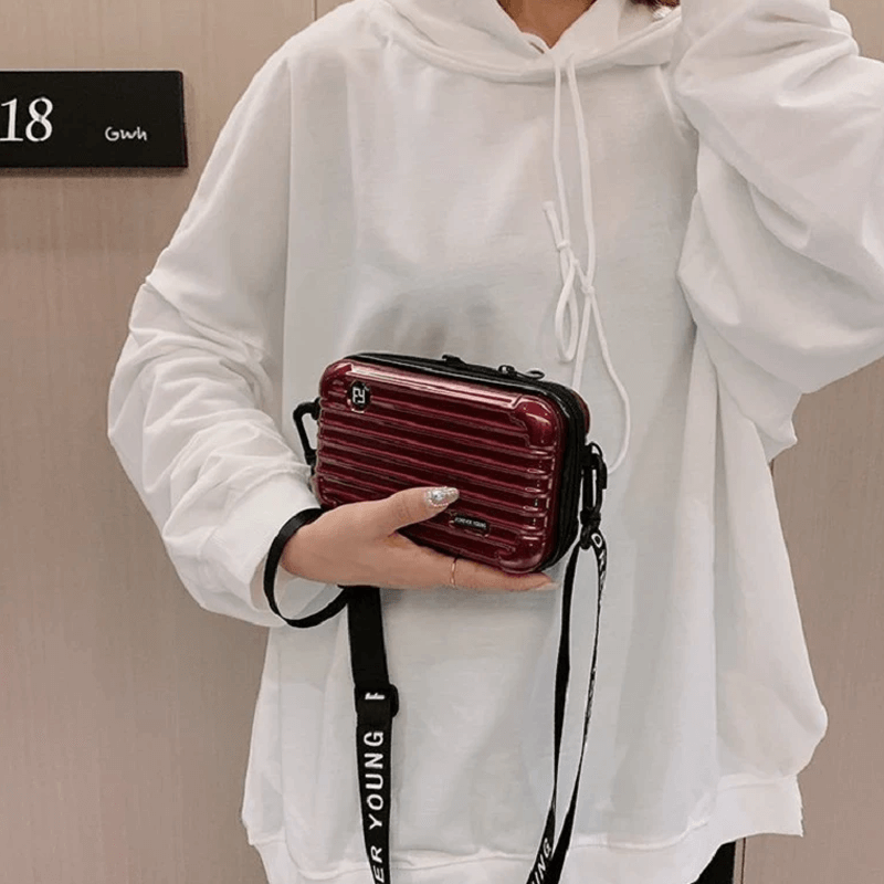 Reiseveske-inspirert crossbody-veske