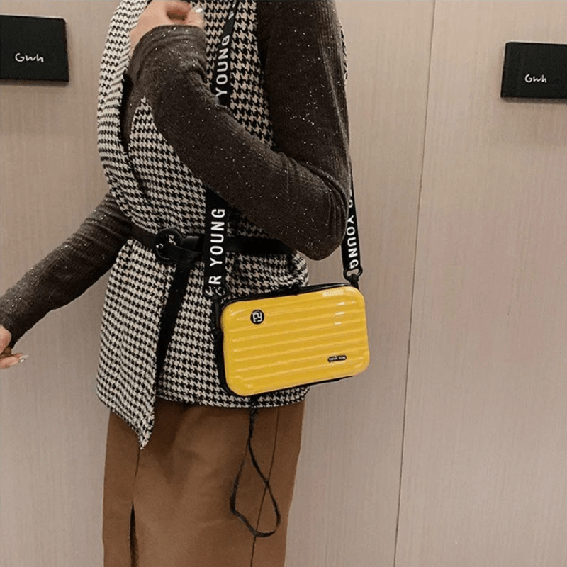Reiseveske-inspirert crossbody-veske