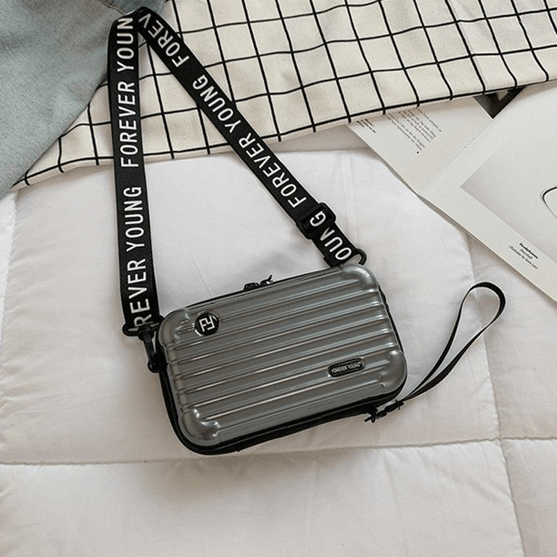 Reiseveske-inspirert crossbody-veske