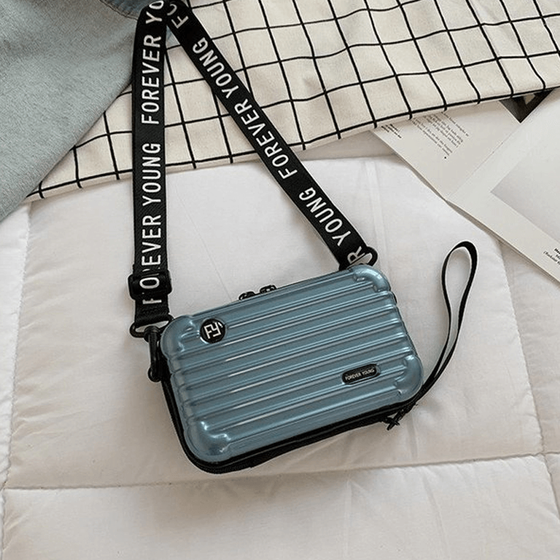 Reiseveske-inspirert crossbody-veske